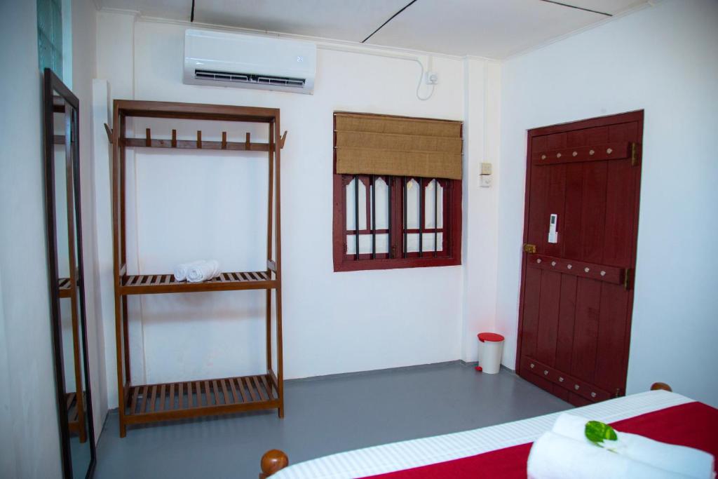 Postel nebo postele na pokoji v ubytování Villa Nutmeg Grove Galle