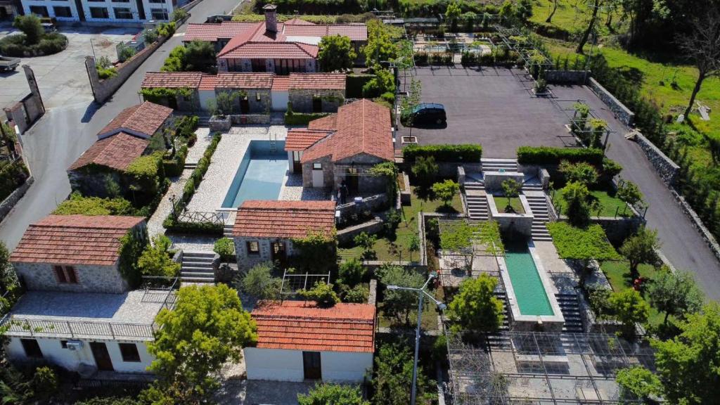 an aerial view of a mansion with a swimming pool at Hotel Opera Jaz in Budva