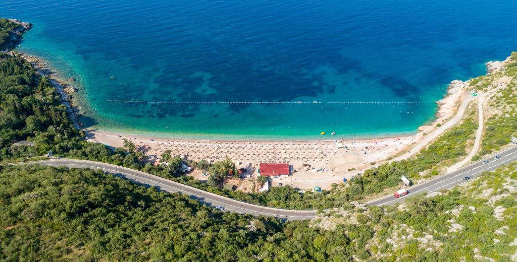 an aerial view of a road next to the beach at Apartments Raymond in Sveti Stefan
