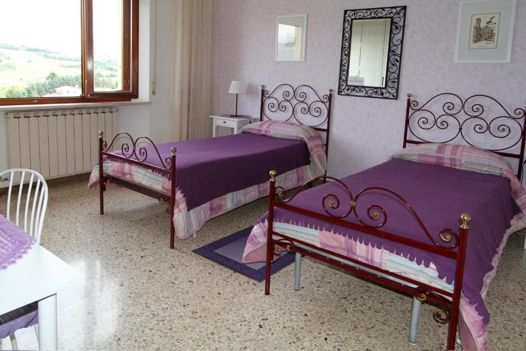 Postel nebo postele na pokoji v ubytování B&B L'Armonia