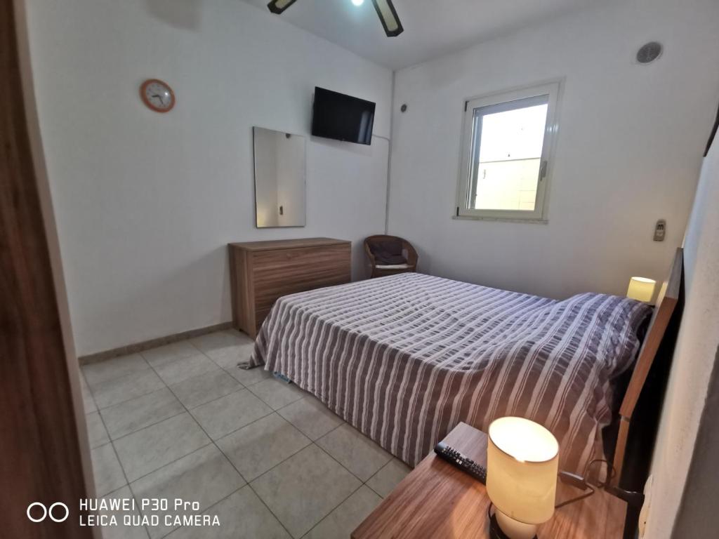 Postel nebo postele na pokoji v ubytování VILLETTA A SCHIERA UNO vicino MALDIVE DEL SALENTO