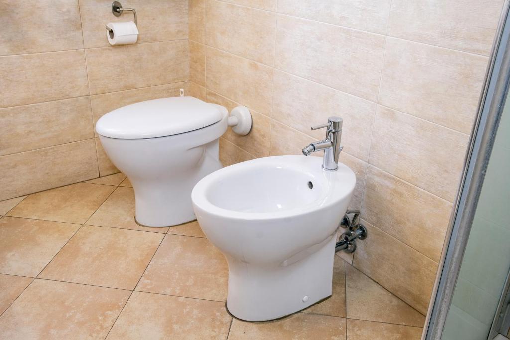 Koupelna v ubytování Hotel Volta