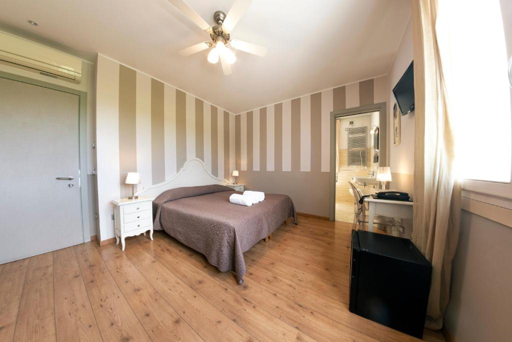 Postel nebo postele na pokoji v ubytování Hotel Volta