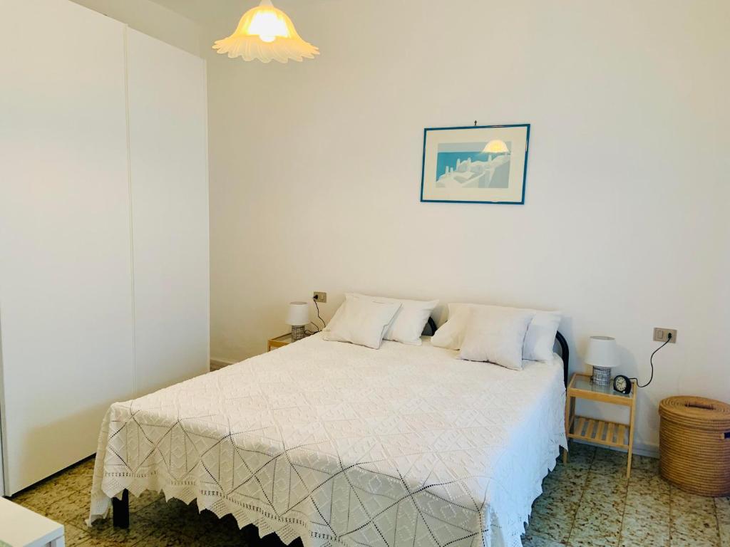 En eller flere senge i et værelse på Casa Assunta