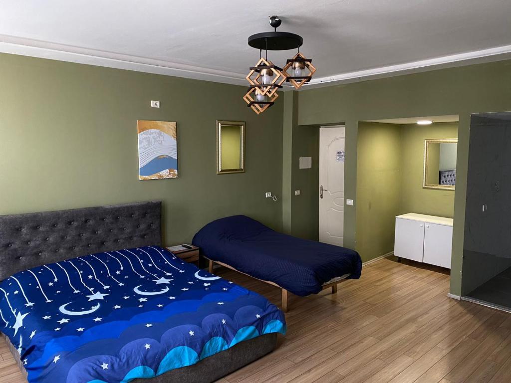 Postel nebo postele na pokoji v ubytování Hotel Driti New Bazaar