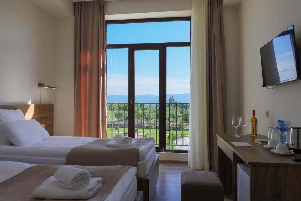 Postel nebo postele na pokoji v ubytování In Gremi Hotel