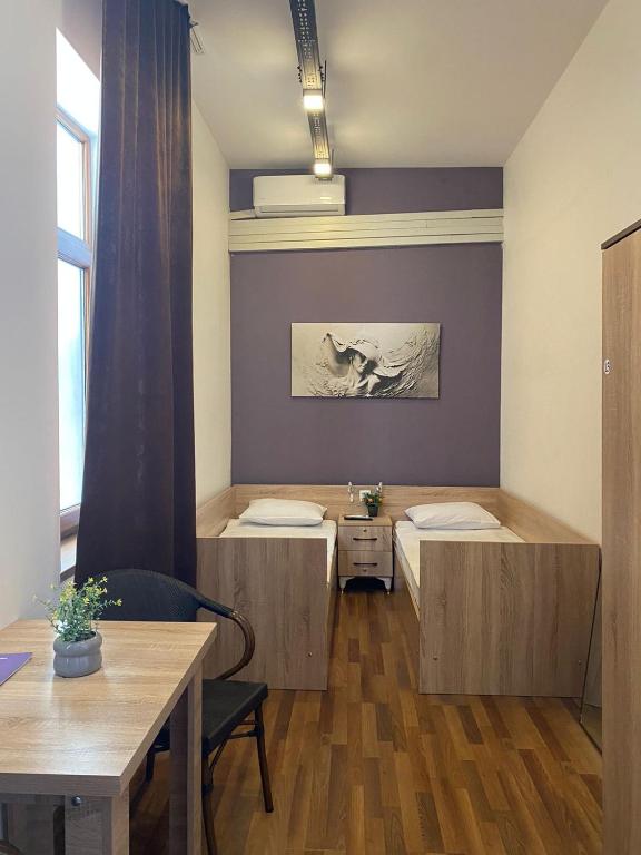 Postel nebo postele na pokoji v ubytování Central Hostel