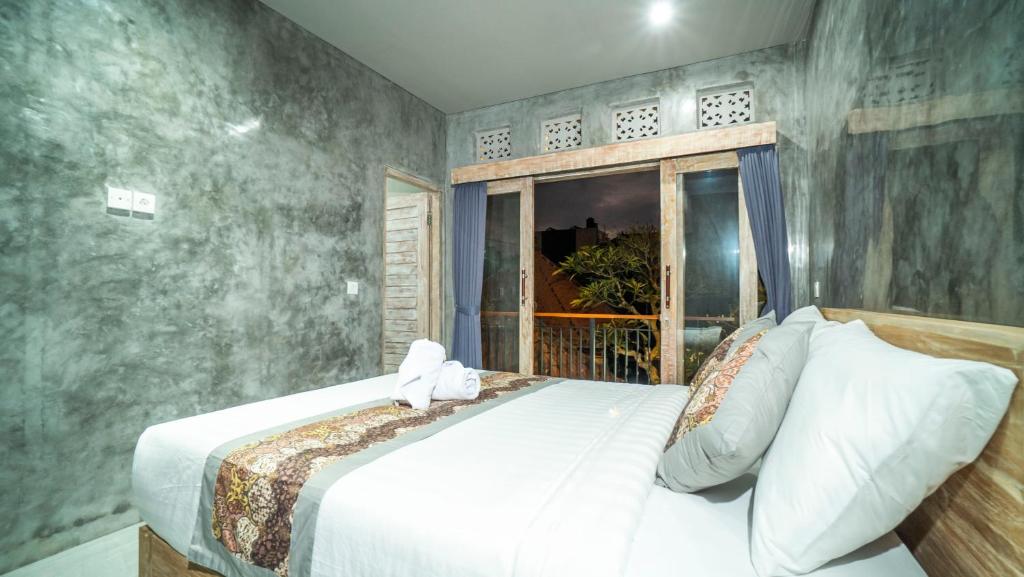 Postel nebo postele na pokoji v ubytování Skyline House Ubud View by EPS