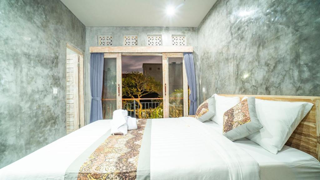Postel nebo postele na pokoji v ubytování Skyline House Ubud View by EPS