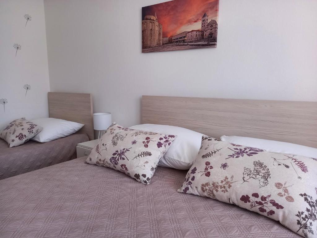Postel nebo postele na pokoji v ubytování Apartman Martina