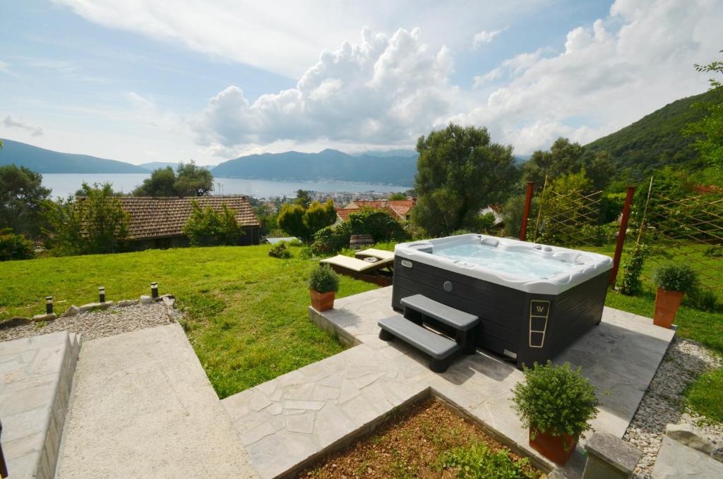 a hot tub sitting on top of a yard at Boka View by Roši in Tivat