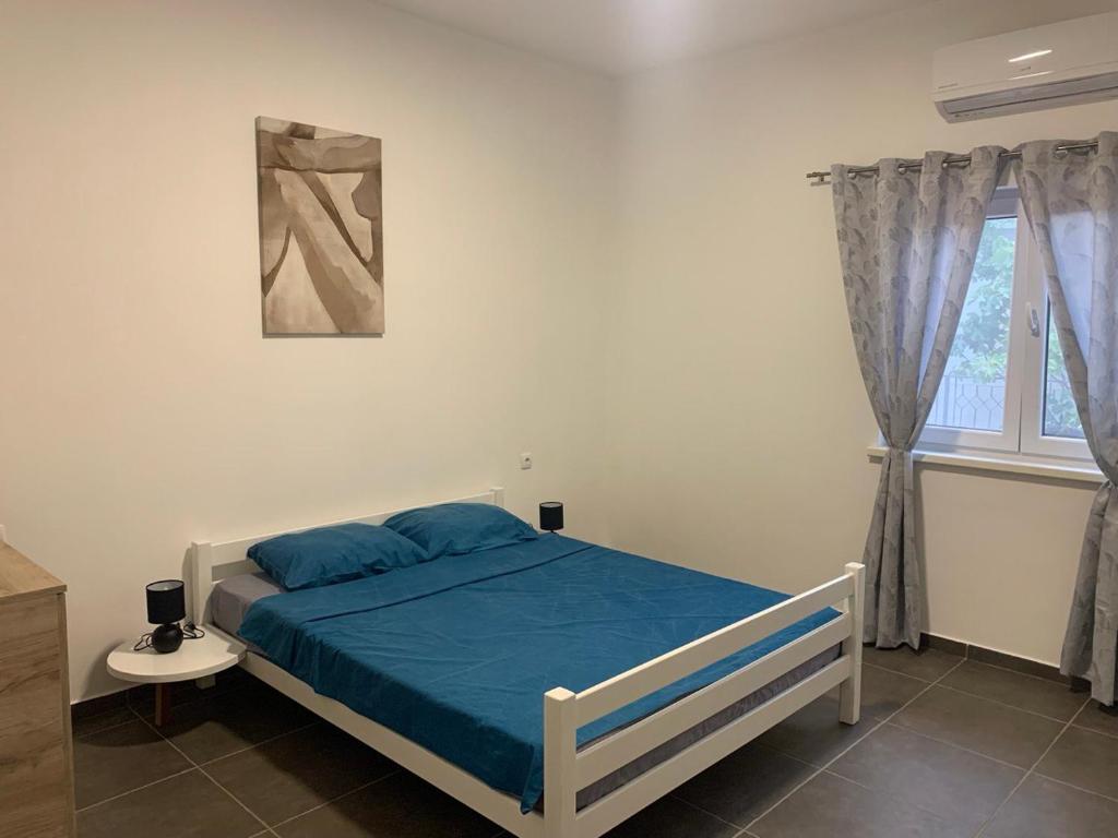 Postel nebo postele na pokoji v ubytování Mariyka Apartaments 2