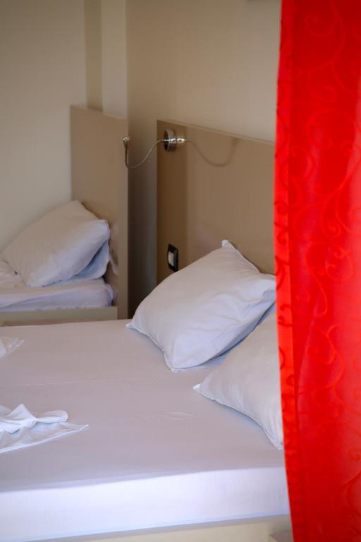 Postel nebo postele na pokoji v ubytování Mucobega Hotel