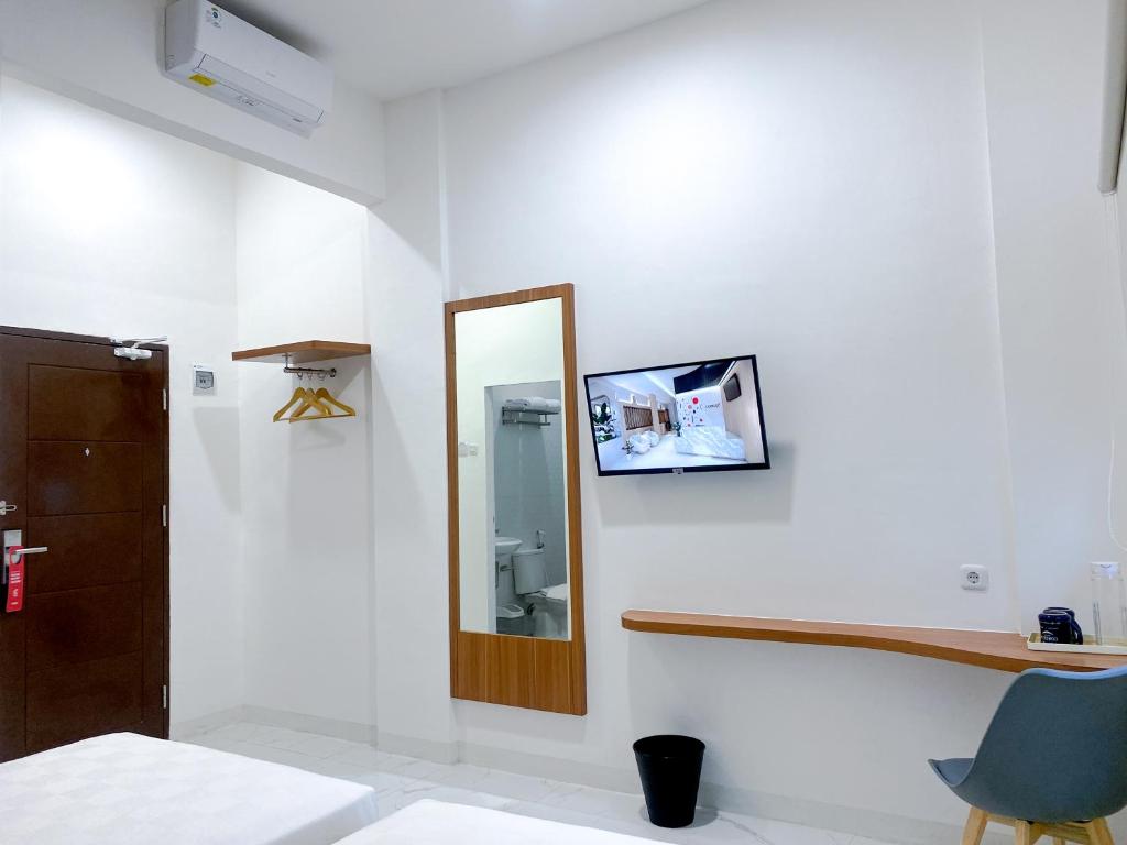 TV a/nebo společenská místnost v ubytování Cordex Hotel Marelan Medan