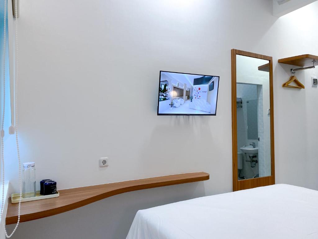 TV a/nebo společenská místnost v ubytování Cordex Hotel Marelan Medan