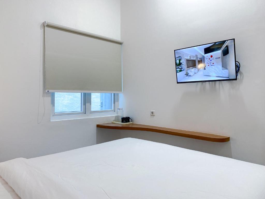 TV a/nebo společenská místnost v ubytování Cordex Hotel Marelan Medan
