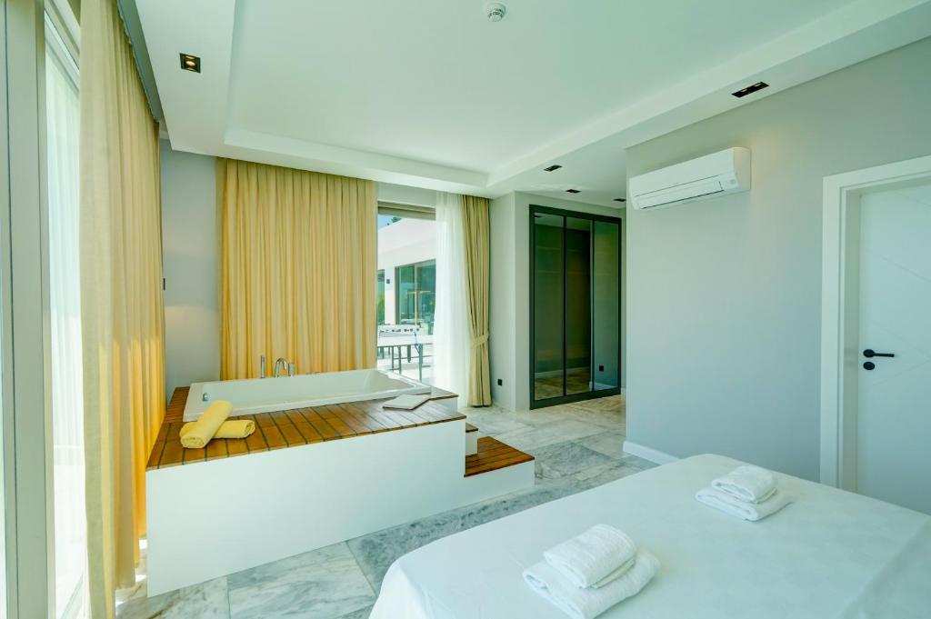 Postel nebo postele na pokoji v ubytování Villa Mars 6 - PLANET LUXURY VILLAS