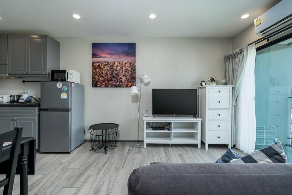 a living room with a couch and a kitchen at С1O Новые Рубль ватсап669З582I976 in Nai Yang Beach