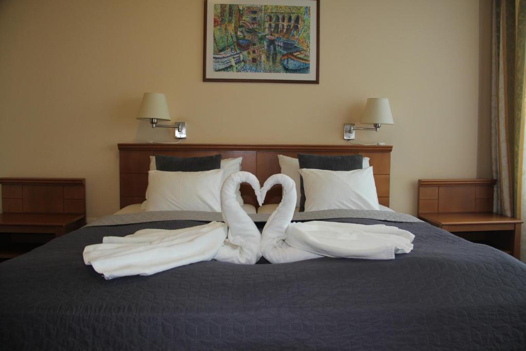 Postel nebo postele na pokoji v ubytování Hotel Estella Superior