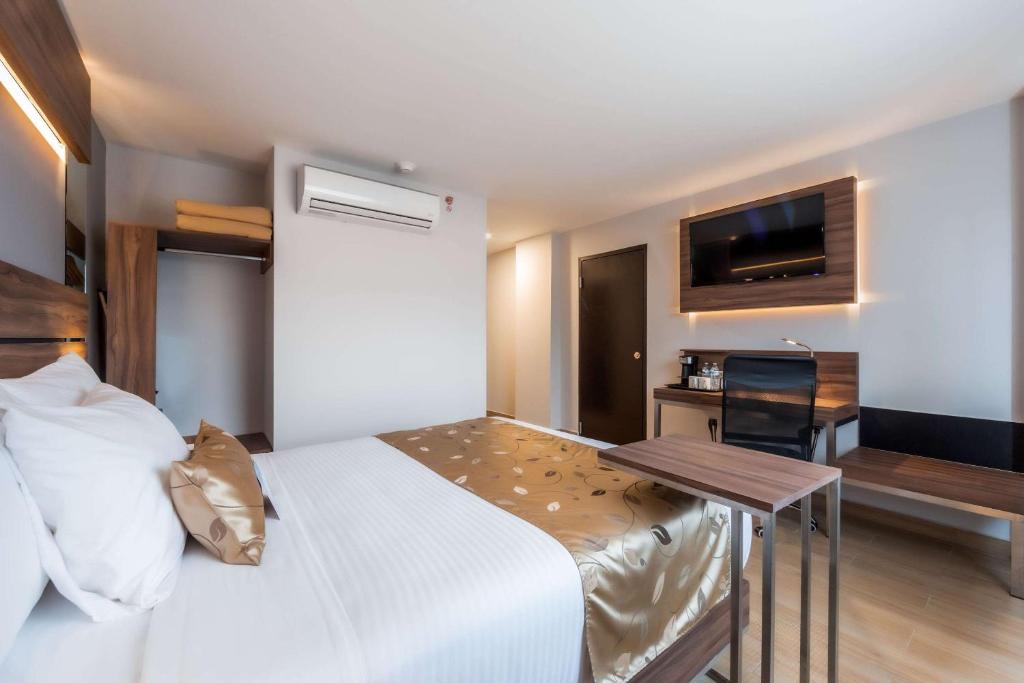 Postel nebo postele na pokoji v ubytování Sleep Inn Tijuana