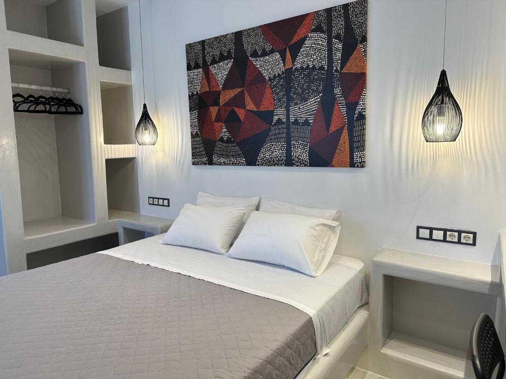 Łóżko lub łóżka w pokoju w obiekcie Aphrodite Hotel & Apartments