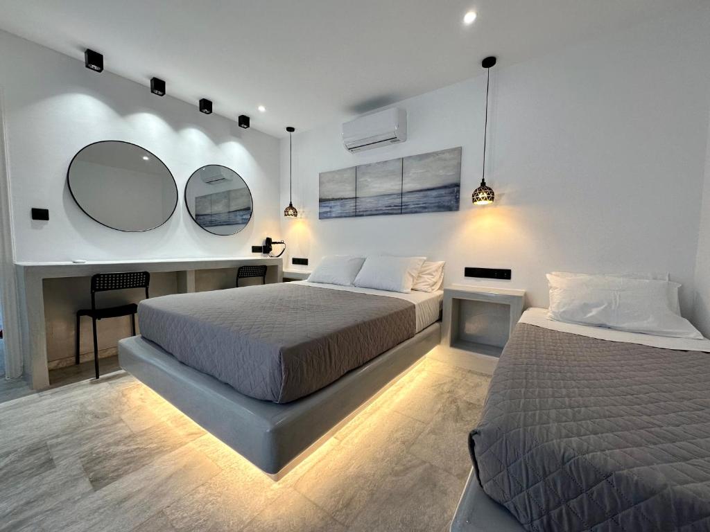 Łóżko lub łóżka w pokoju w obiekcie Aphrodite Hotel & Apartments