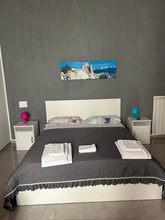 Postel nebo postele na pokoji v ubytování Il Vico Del Drago