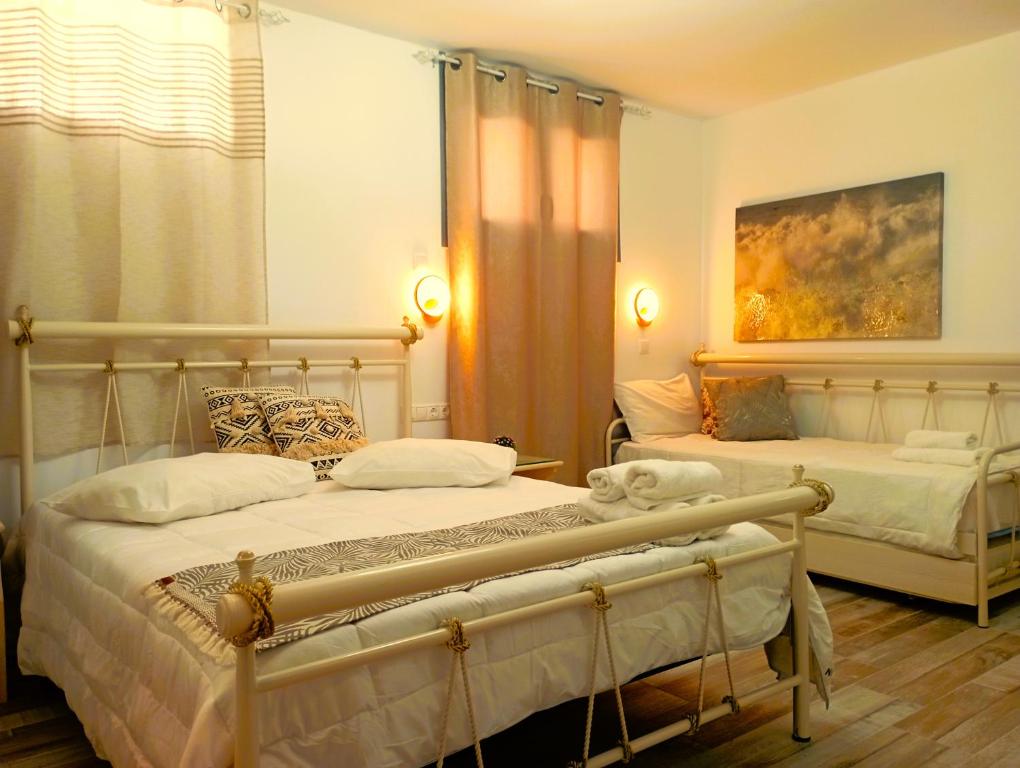 Ένα ή περισσότερα κρεβάτια σε δωμάτιο στο Relaxaki Apartment, Naxos town