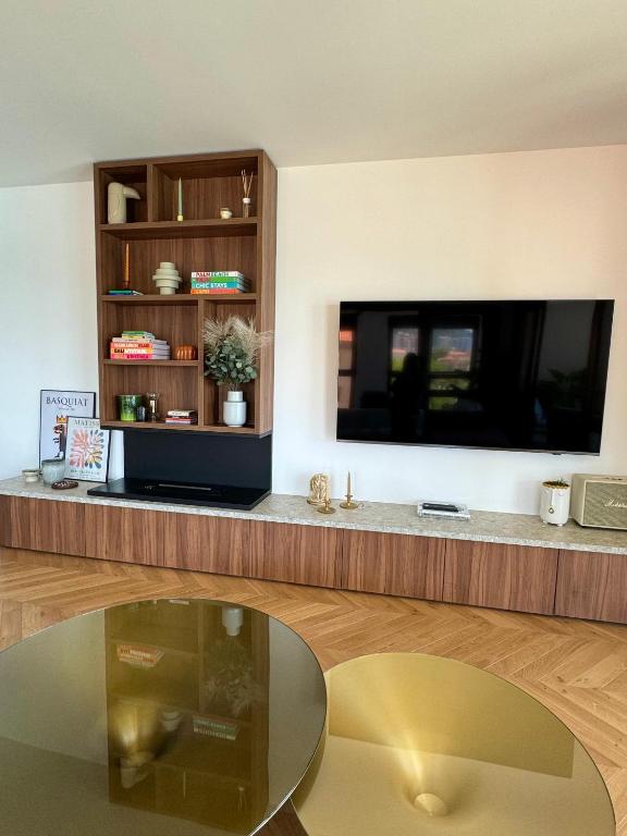 TV a/nebo společenská místnost v ubytování Hyper Centre, Front De Mer