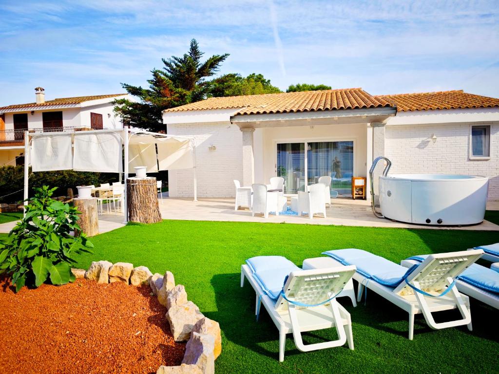Ikebana Villas a Porto Pino - Esclusiva Villa Fronte Mare