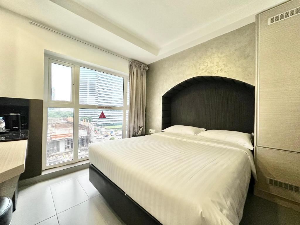 Llit o llits en una habitació de The Snooze Hotel at Bugis