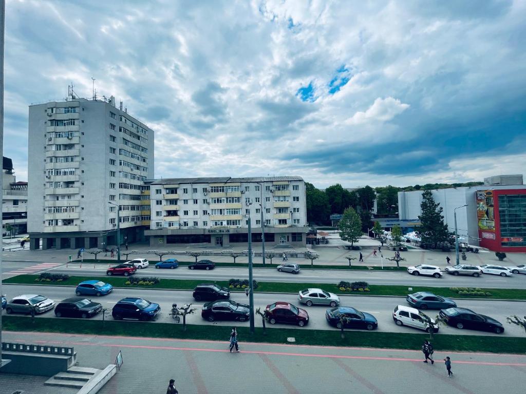 a parking lot with cars parked in a parking lot at La Burini in Vaslui