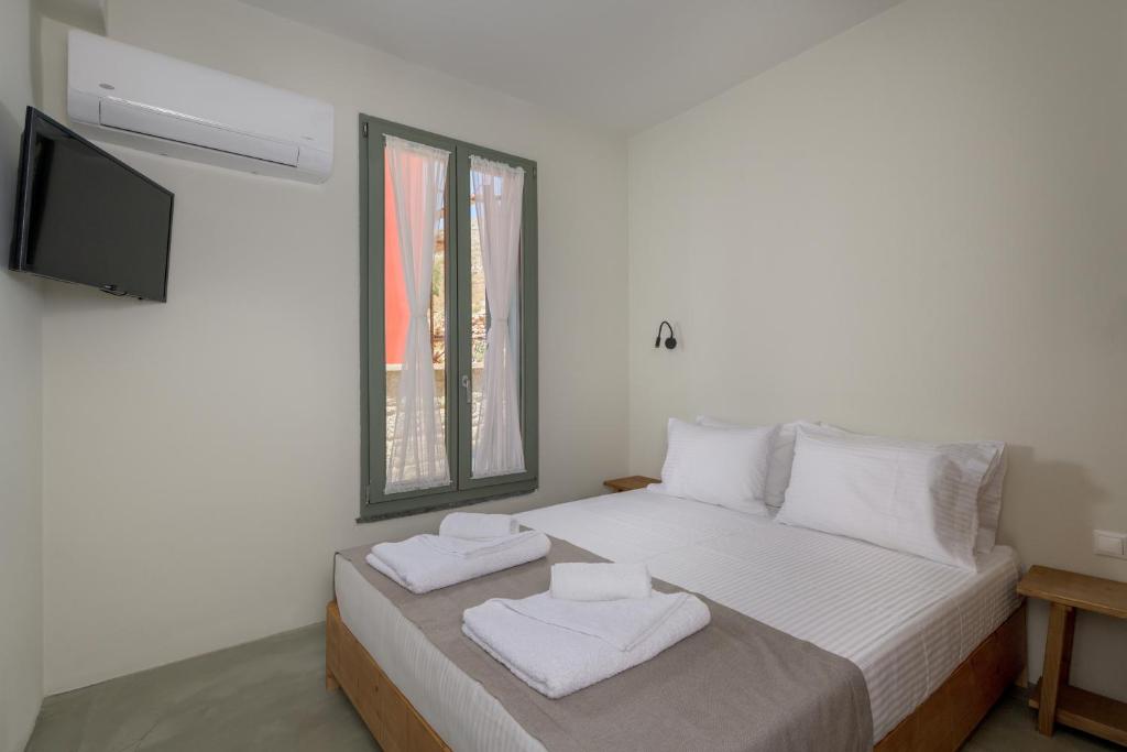 Postel nebo postele na pokoji v ubytování Onar Residences Chalki