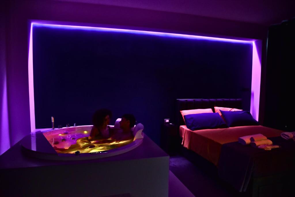 Postel nebo postele na pokoji v ubytování Palms Suites