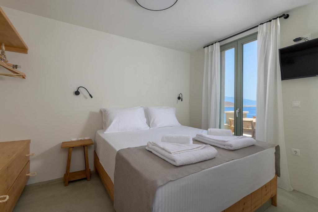 Postel nebo postele na pokoji v ubytování Onar Residences Chalki