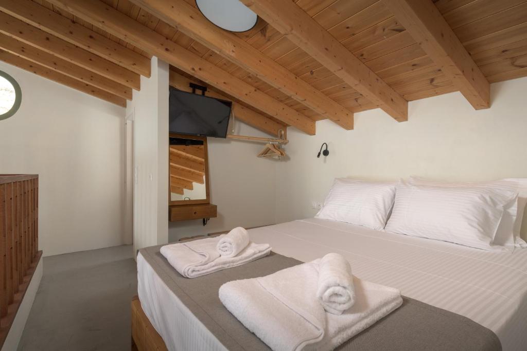 Postel nebo postele na pokoji v ubytování Onar Residences Chalki