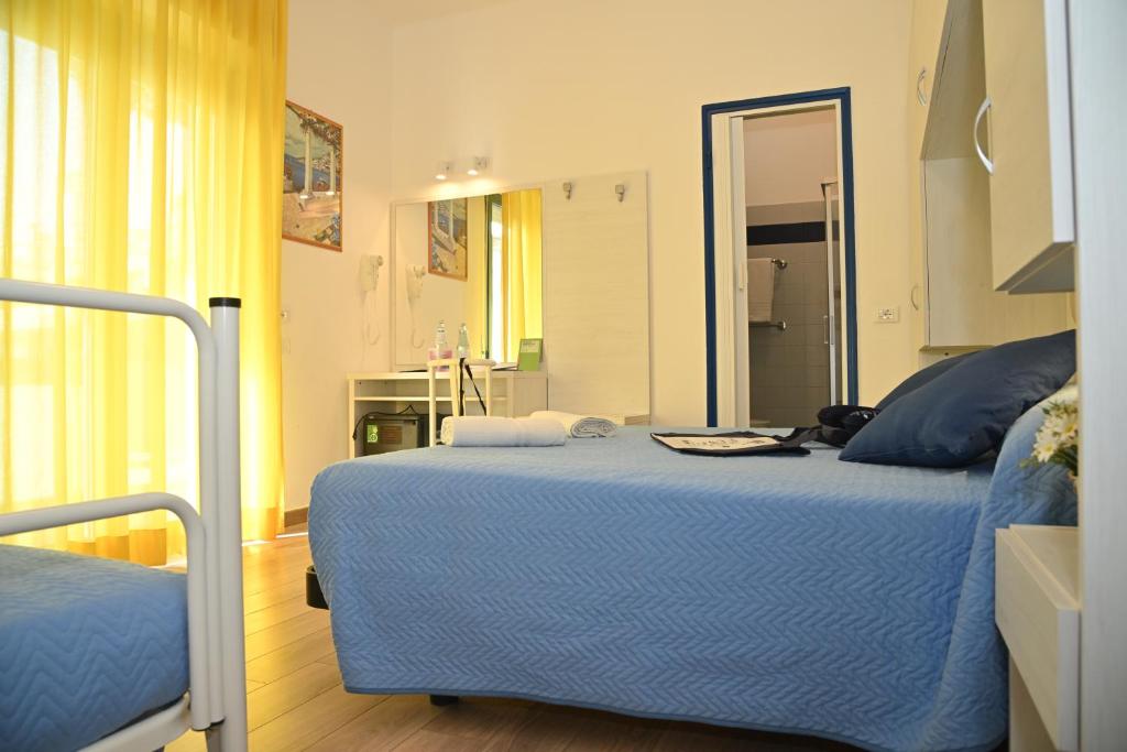 Postel nebo postele na pokoji v ubytování Hotel Tivoli