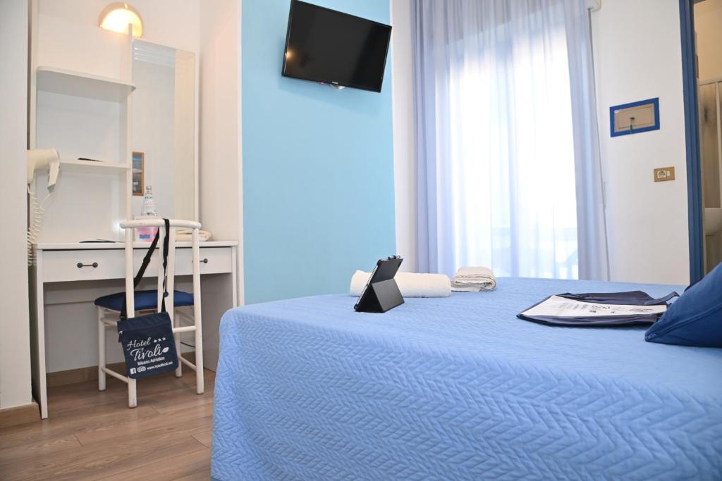Postel nebo postele na pokoji v ubytování Hotel Tivoli
