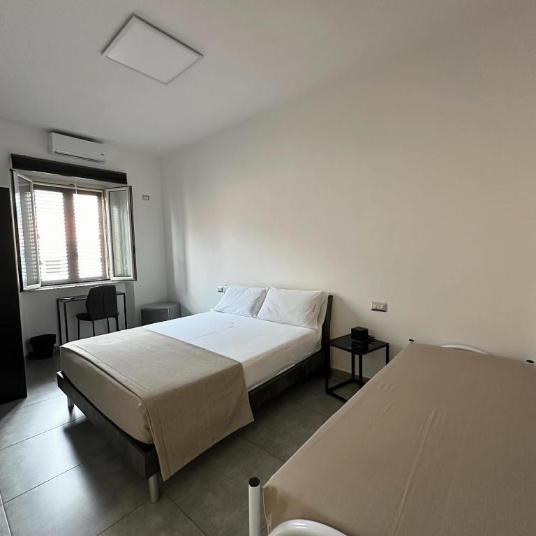 Postel nebo postele na pokoji v ubytování Grenada Home