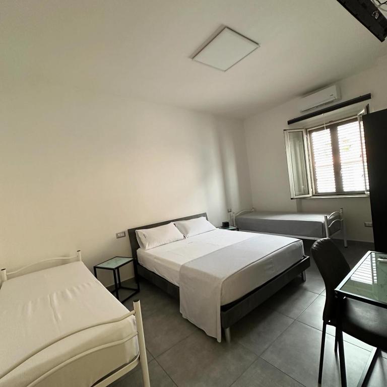 Postel nebo postele na pokoji v ubytování Grenada Home