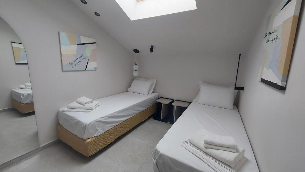 Postel nebo postele na pokoji v ubytování Kynara Elegant Living