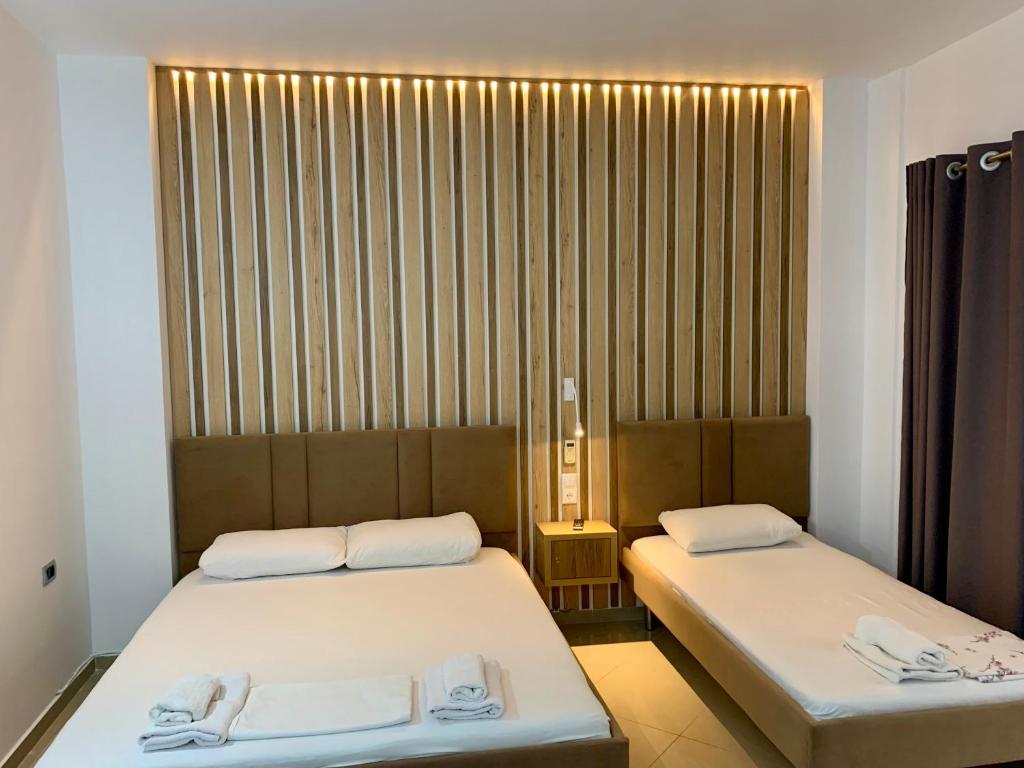 Postel nebo postele na pokoji v ubytování Hotel Piazza