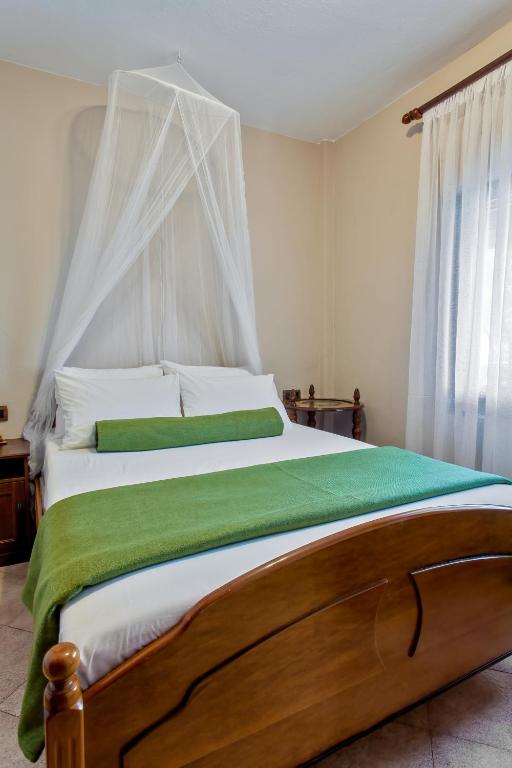 Postel nebo postele na pokoji v ubytování Stavros & Maria's Haus