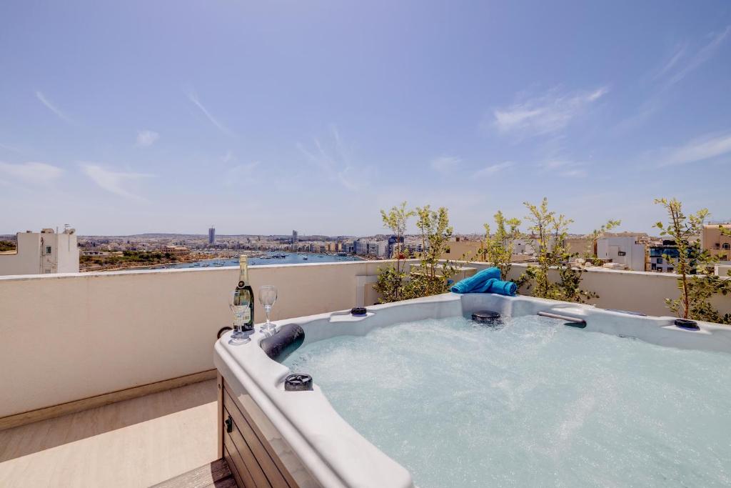 Curated visual reference: Fresh Look at Stylish Penthouse Rooftop Hot Tub Harbour Views Sliema Updated Prices