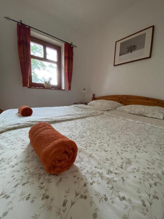 A bed or beds in a room at Jákó Ház