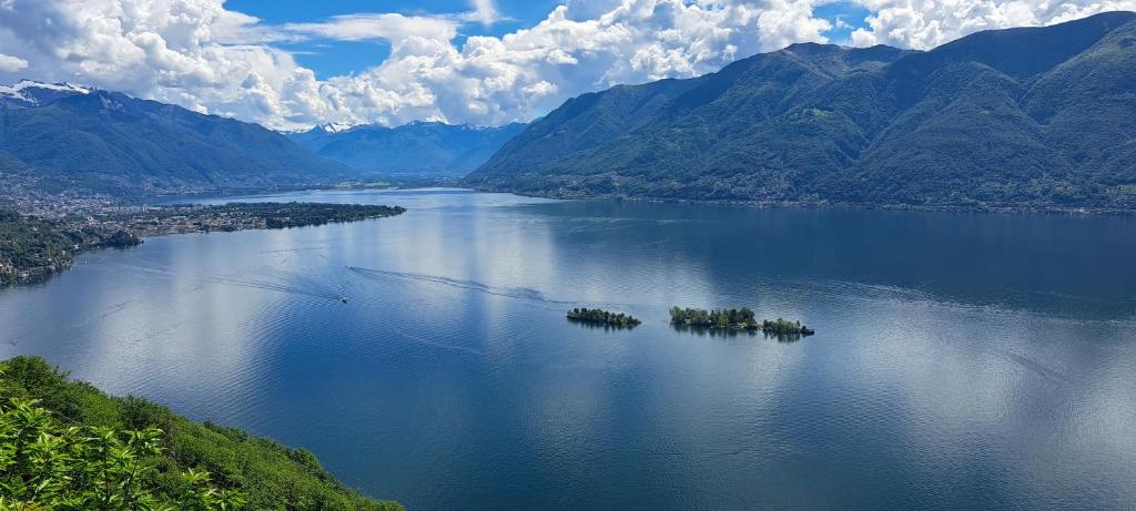 an aerial view of a large body of water with mountains at Appartamento La Torretta in Locarno