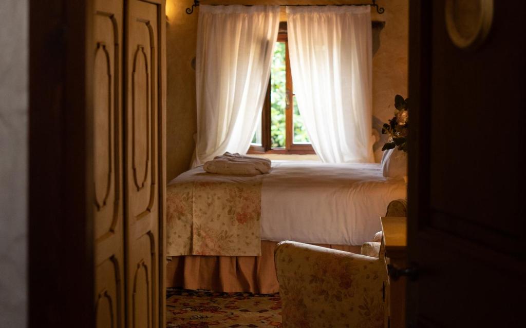 Postel nebo postele na pokoji v ubytování Relais La Magioca -Adults Only-
