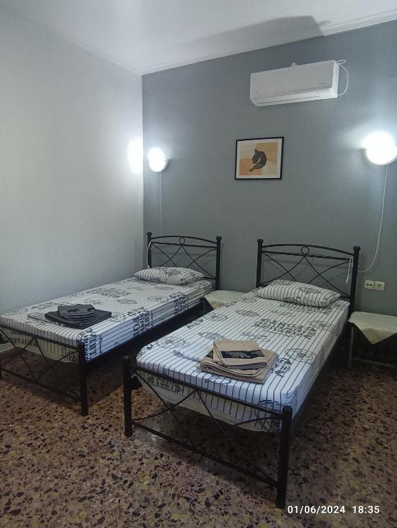 Ένα ή περισσότερα κρεβάτια σε δωμάτιο στο RENA APARTMENTS
