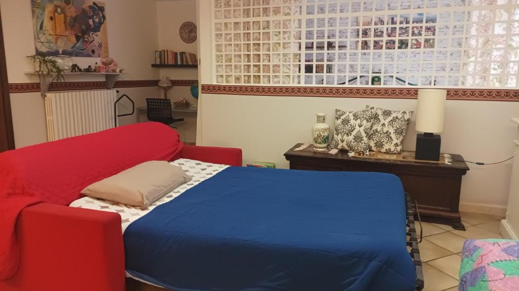 En eller flere senge i et værelse på appartamento in villetta il giardino dei semplici
