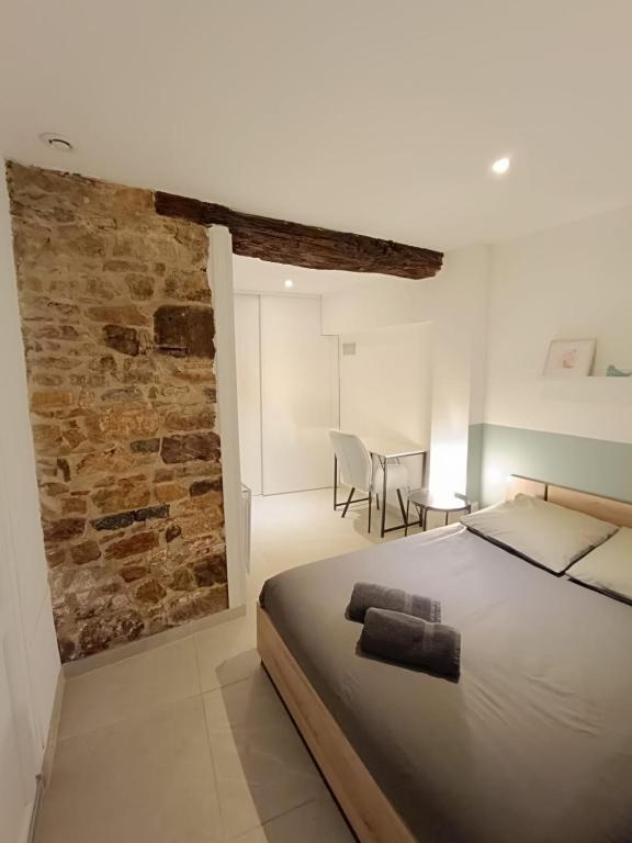 Postel nebo postele na pokoji v ubytování Studio Les Etoiles de Chasselay